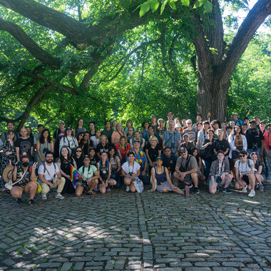 2022 Let's Go Birding Together in Central Park attendees smile at the camera