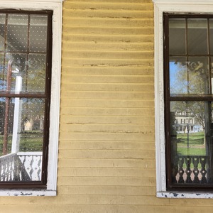 An image of two windows of NYC Bird Alliance's former seasonal environmental center in Governors Island's Nolan Park treated by window film.