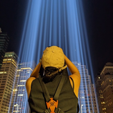 A volunteer joins NYC staff to monitor the 9/11 Tribute in Light memorial for birds trapped in the light beams. Photo: NYC Bird Alliance