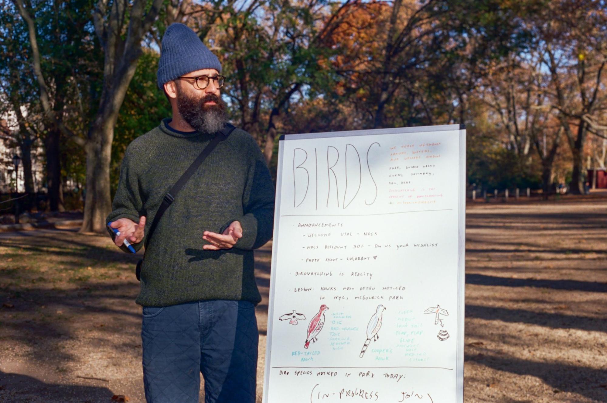 Michael Lombardo, host of the McGolrick Bird Club, explains the difference between Red-tailed Hawks and Cooper’s Hawks for easy identification. Photo: Louisa Belk.